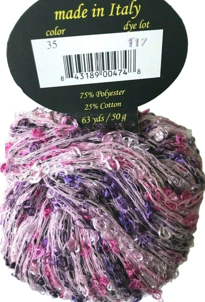 Multicolored yarn ball with a label indicating 'made in Italy' and fiber content.