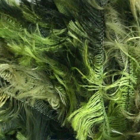 Close-up of green textured fabric with a chain detail