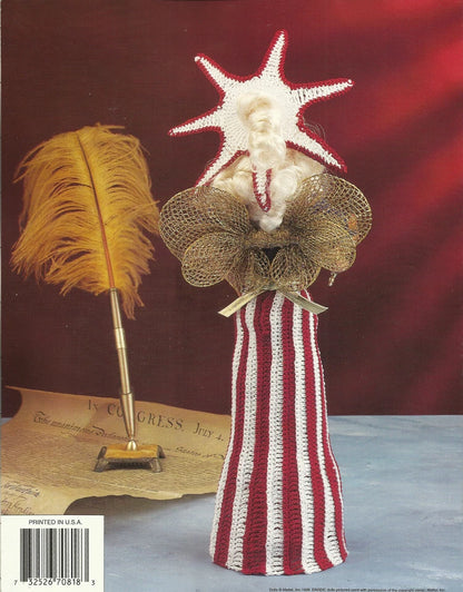Decorative item with starfish, feathers, and striped vase on a red background
