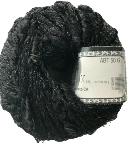 Black yarn ball with a label on a white background