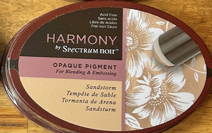 A Spectrum Noir Harmony Opaque Pigment Inkpad in the color Sandstorm, which is acid-free, archival, and designed for blending and embossing.