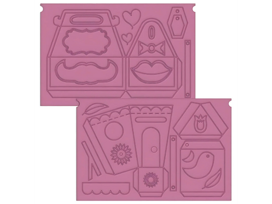Pink rubber stamp set with various shapes and designs on a white background