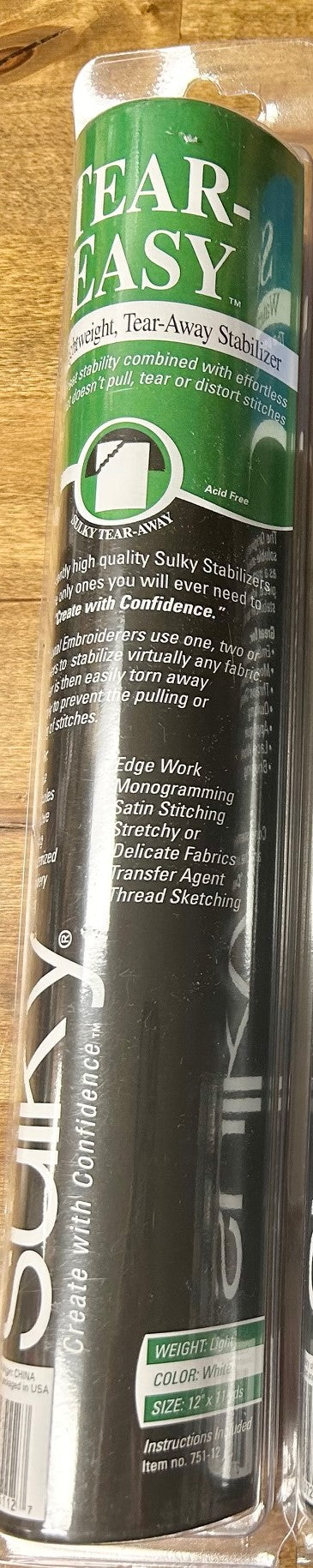 A roll of Sulky Tear-Easy Stabilizer, a soft, lightweight, tear-away embroidery backing material is pictured. The product provides stability for stitches and is easily removed without distorting them. It is suitable for machine embroidery, quilting, and applique on various fabrics. 
